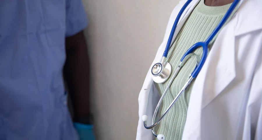 Clinician holding a stethoscope